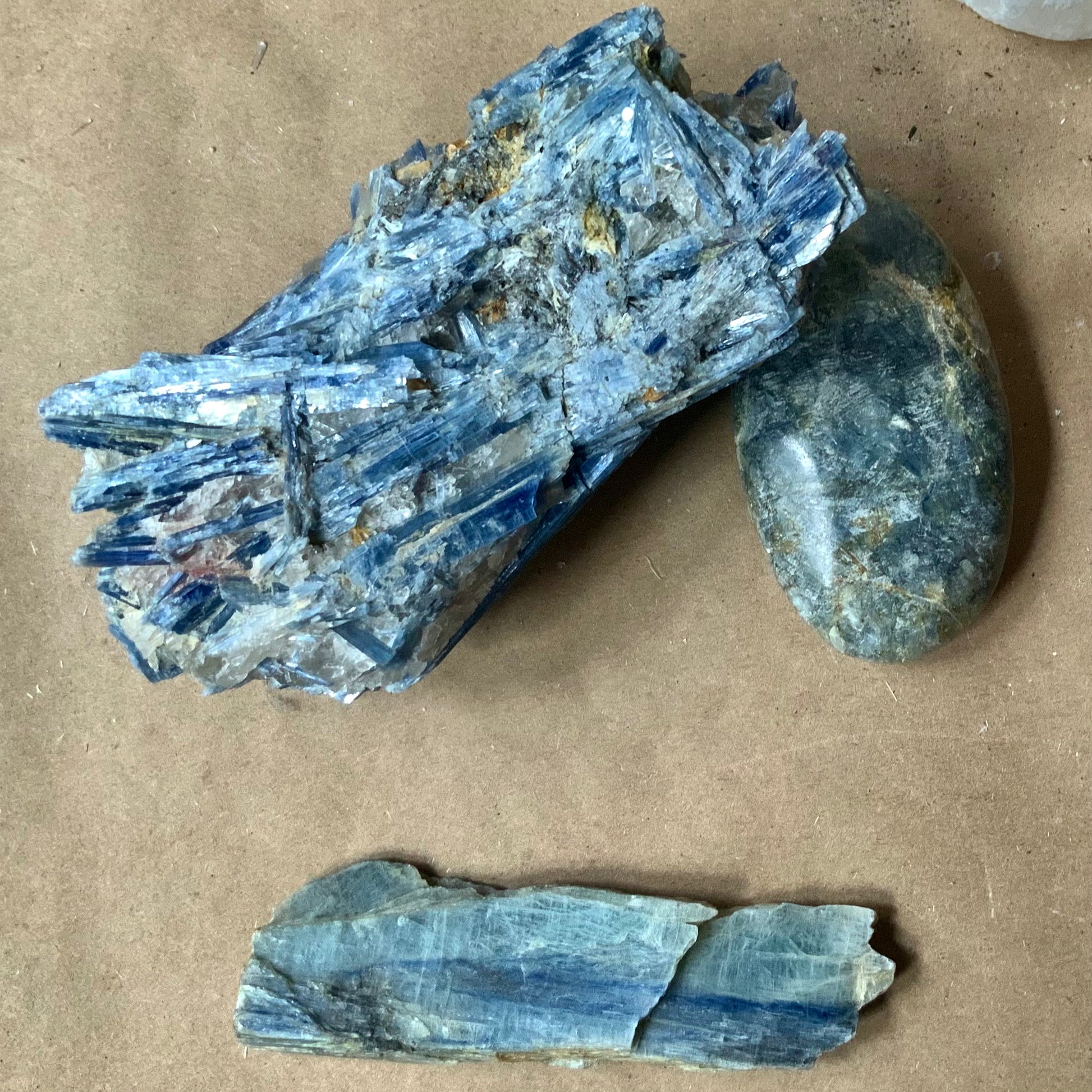 raw blue kyanite with polished pieces